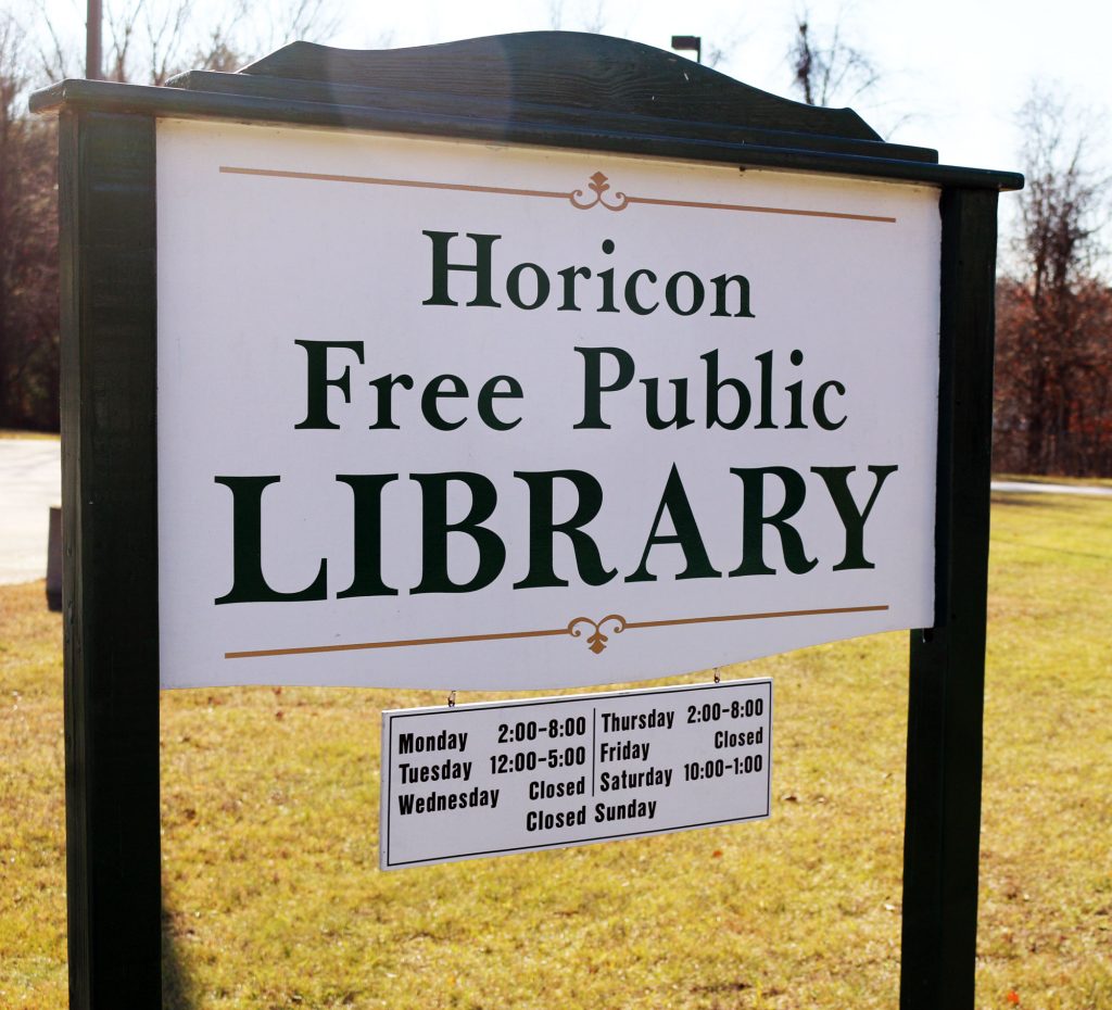 Horicon library sign and hours